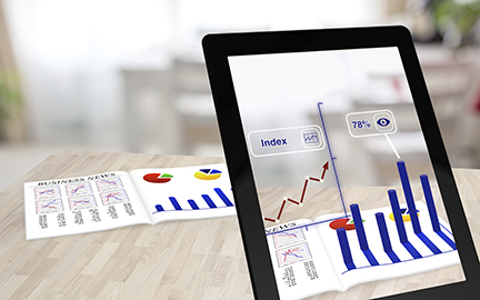 Augmented reality business magazine seen through a tablet with enhanced charts