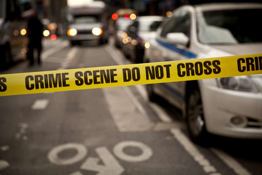 What is the first step in analyzing a crime scene? Police tape image