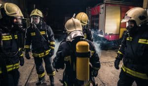 Active Threat and Emergency Response Training for Fire Departments. Firefighters gather together to make a response plan.