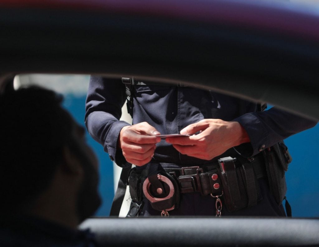 Georgia Law Enforcement checking an ID at a traffic stop