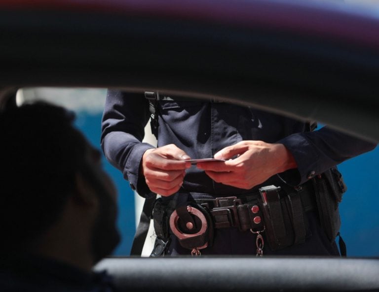 Georgia Law Enforcement checking an ID at a traffic stop